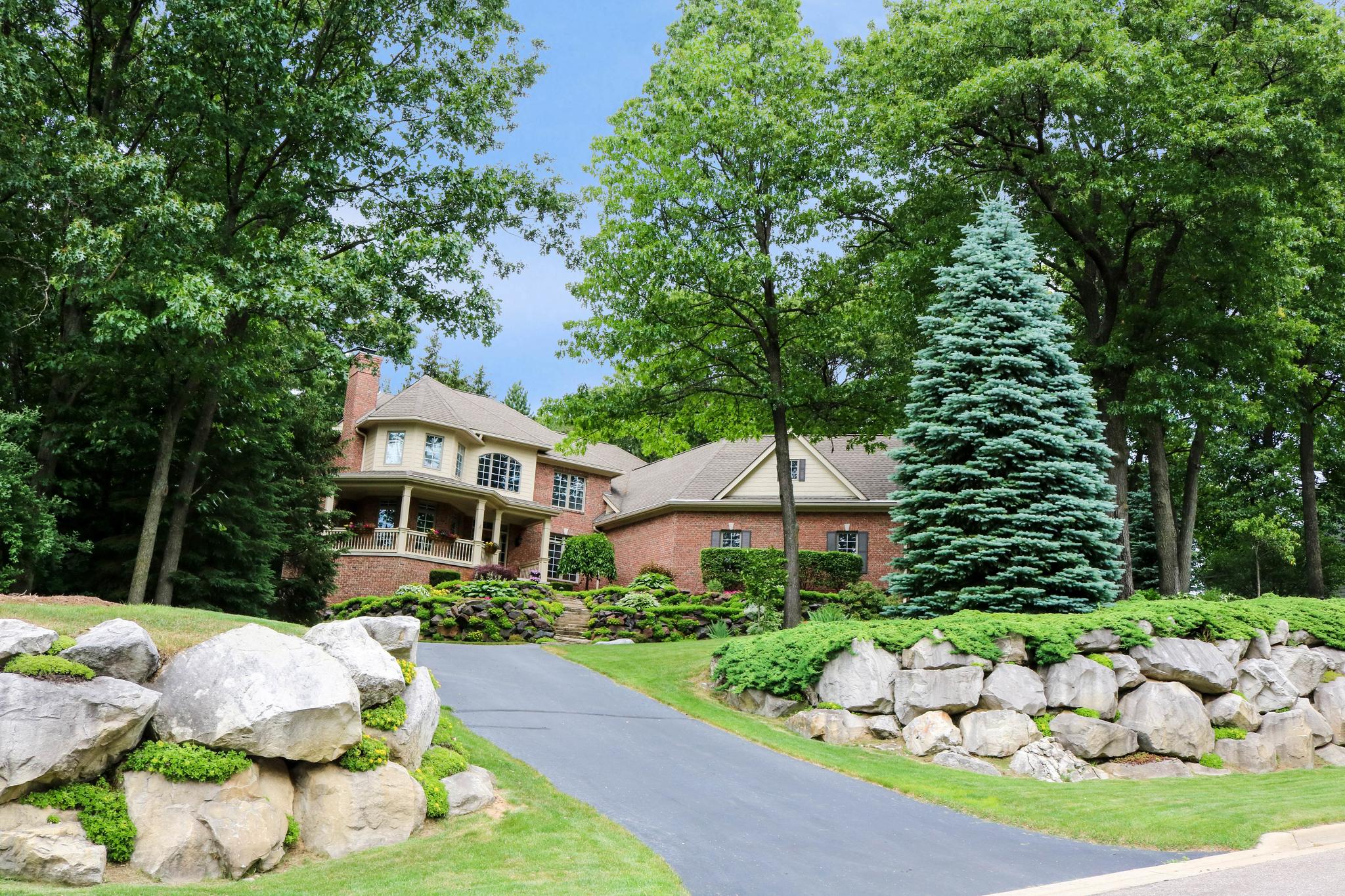 Boulders featured in the landscaping of this Dominion home